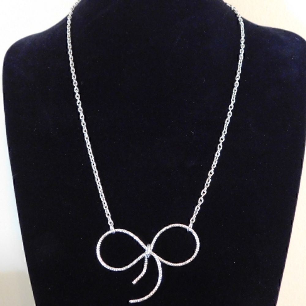 Silver Toned Bow Necklace with Clear Stones